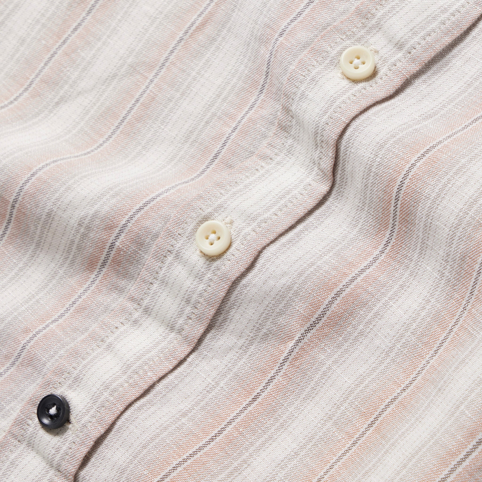 material shot of the buttons of The Short Sleeve California in Dusty Rose Stripe, Wovens by Taylor Stitch