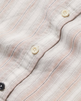 material shot of the buttons of The Short Sleeve California in Dusty Rose Stripe, Wovens by Taylor Stitch