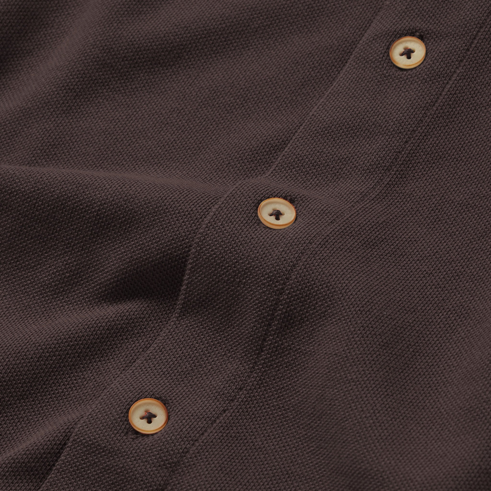 material shot of the buttons on The Short Sleeve California in Espresso Pique, Wovens by Taylor Stitch