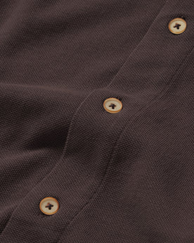 material shot of the buttons on The Short Sleeve California in Espresso Pique, Wovens by Taylor Stitch