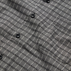 material shot of the buttons on The Short Sleeve Hawthorne in Navy Stripe
