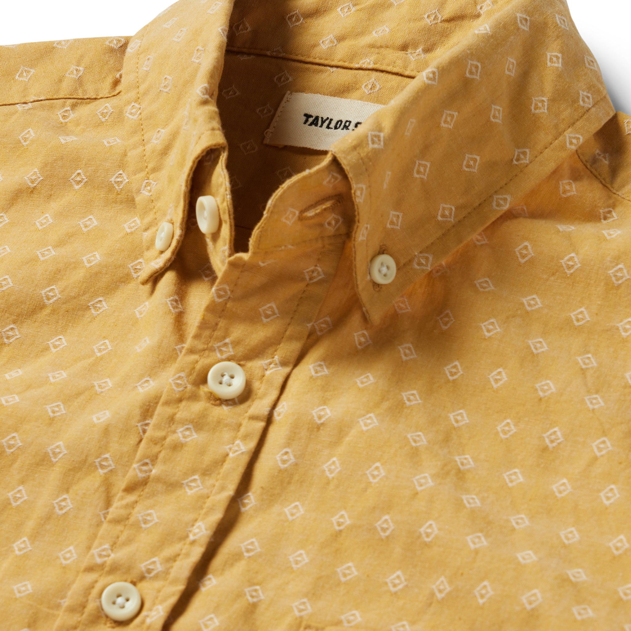 material shot of the collar and buttons on The Short Sleeve Jack in Gold Diamond, Wovens by Taylor Stitch