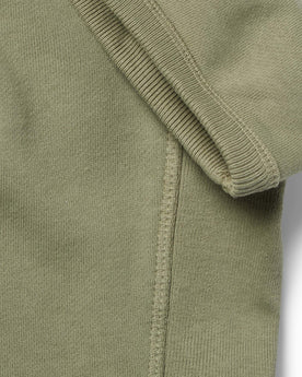 material shot of the ribbed sleeves on The Short Sleeve Fillmore Crew in Olive, Knits by Taylor Stitch