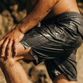 fit model coming from the water in The Adventure Short in Coal