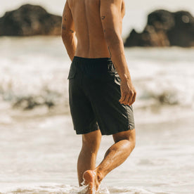 fit model walking in the water in The Adventure Short in Coal