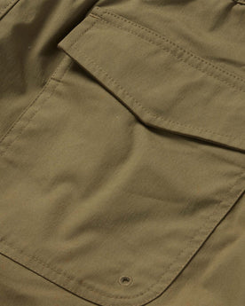 material shot of the back pocket of The Adventure Short in Olive, Bottoms by Taylor Stitch