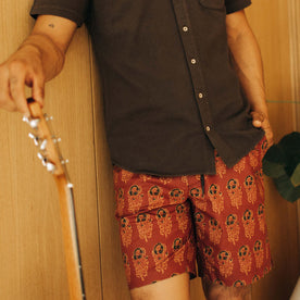 fit model with his hand in the pocket of The Adventure Short in Rust Floral