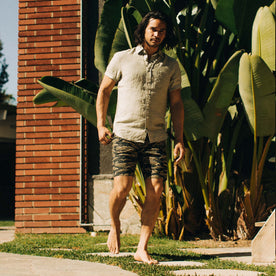 fit model walking in The Adventure Short in Tiger Camo
