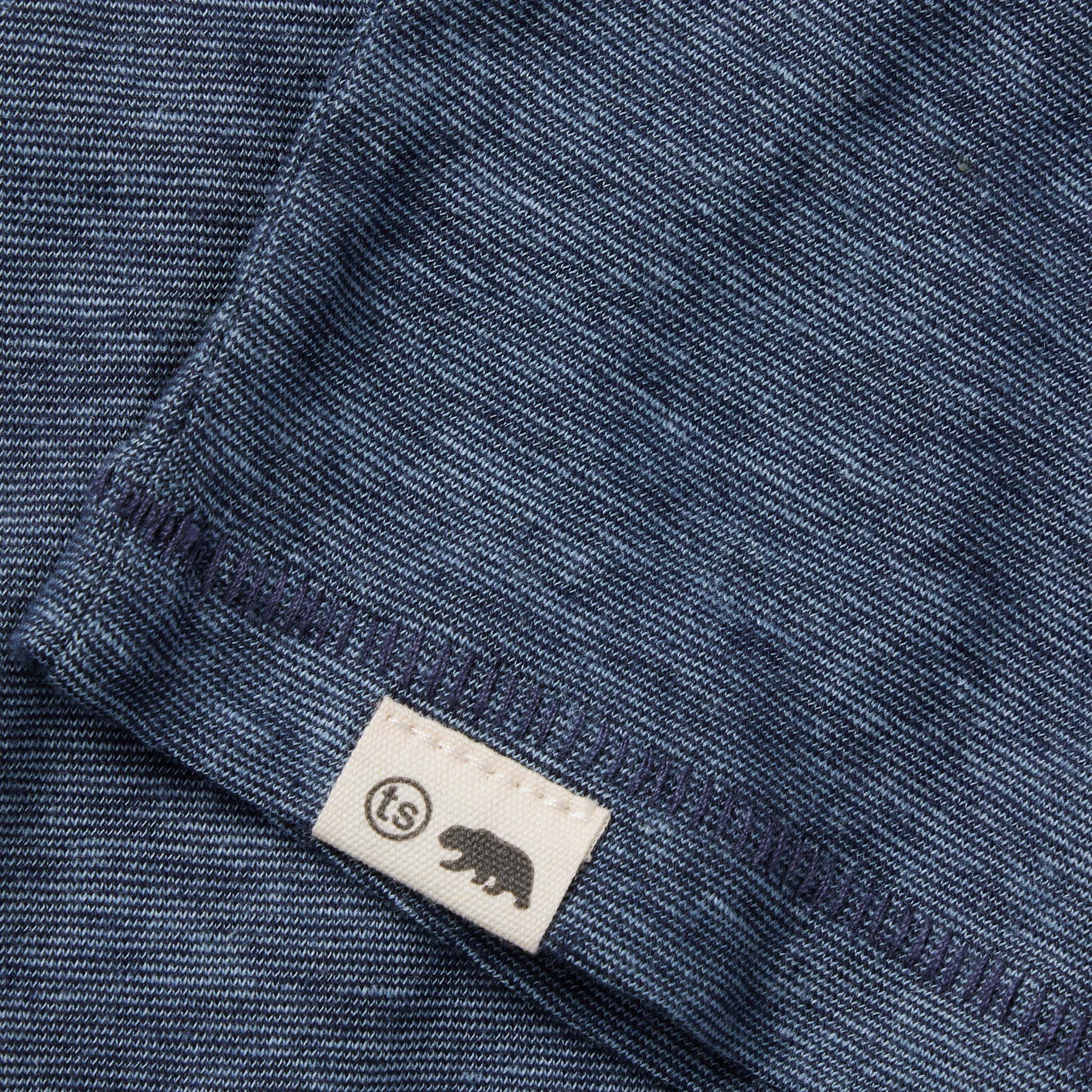 material shot of the hem and logo on The Cotton Hemp Tee in Slate and Navy Stripe, Knits by Taylor Stitch