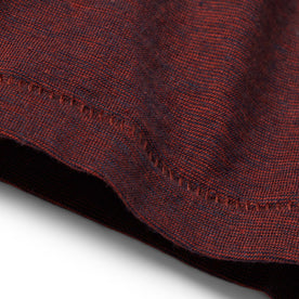 material shot of the hem on The Cotton Hemp Tee in Rust and Navy Stripe