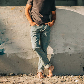 fit model wearing The Democratic Jean in 24-Month Japanese Selvage on beach