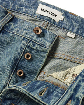 material shot of the buttons on The Democratic Jean in 24-Month Japanese Selvage, Bottoms by Taylor Stitch