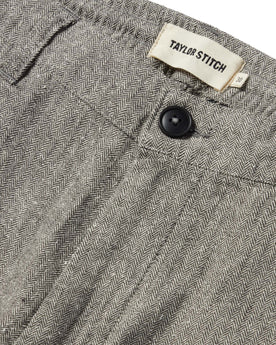 material shot of the button closure on The Easy Pant in Charcoal Herringbone, Bottoms by Taylor Stitch