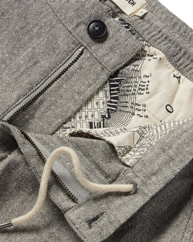 material shot of the internal drawstring and SF map printing on The Easy Pant in Charcoal Herringbone, Bottoms by Taylor Stitch