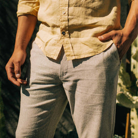 fit model wearing The Easy Pant in Natural Herringbone with his hand in his pocket