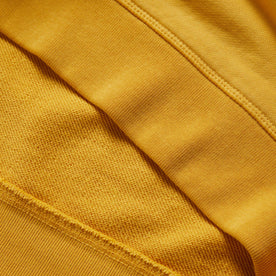 material shot of the ribbed hem on The Fillmore Crewneck in Canary