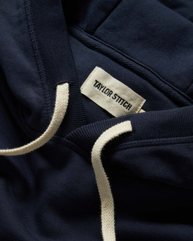 material shot of the drawstrings on The Fillmore Hoodie in Dark Navy, Knits by Taylor Stitch