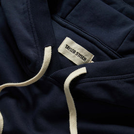 material shot of the drawstrings on The Fillmore Hoodie in Dark Navy