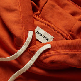 material shot of the drawstring and hood of The Fillmore Hoodie in Rust