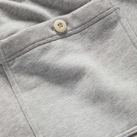 material shot of the rear pocket with button on The Fillmore Pant in Heather Grey