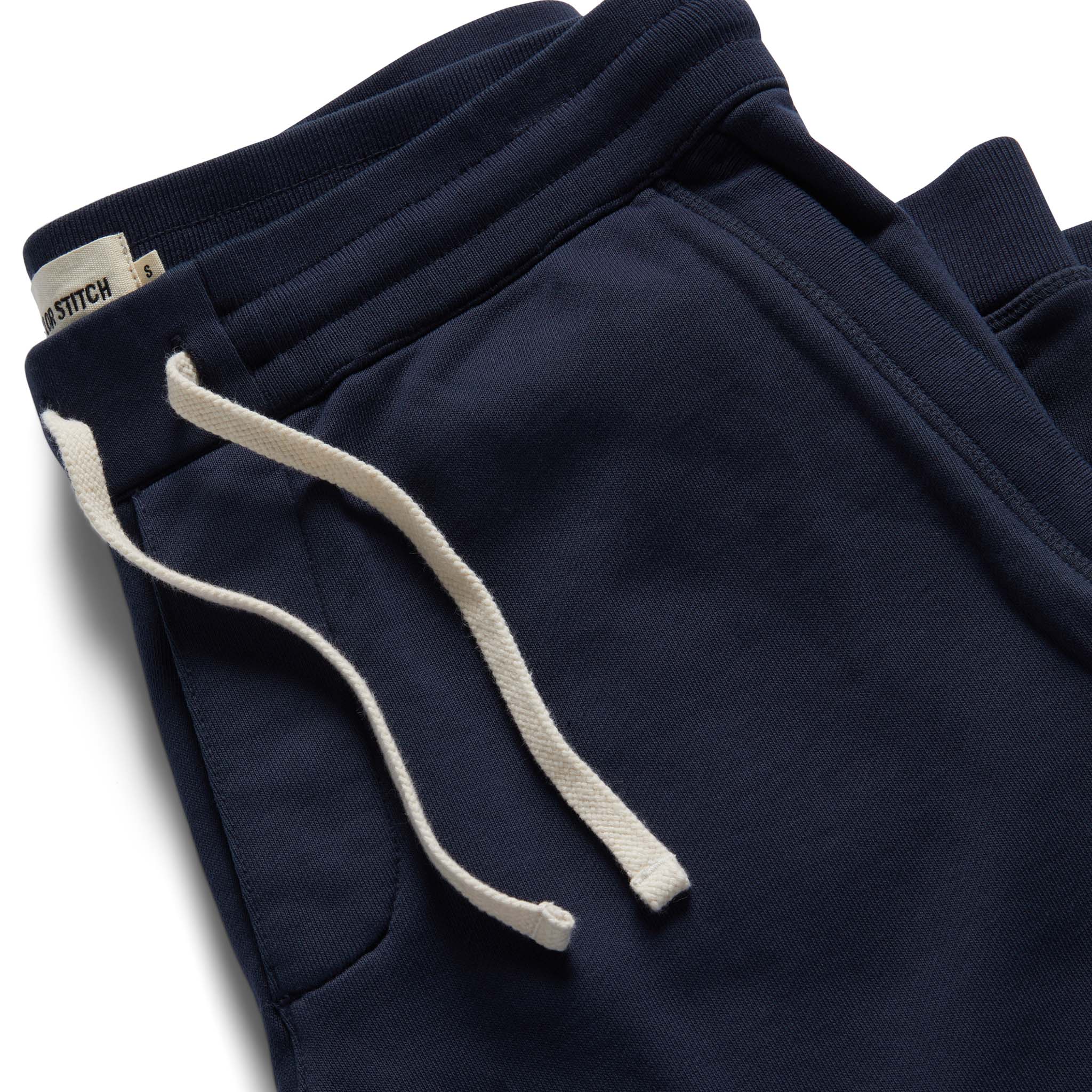material shot of the drawstring and ribbed waist on The Fillmore Pant in Dark Navy, Bottoms by Taylor Stitch