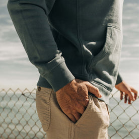fit model standing in The Fillmore Hoodie in Ocean and Natural 