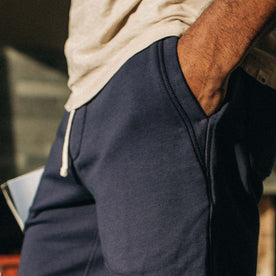 fit model showing the pocket detail of The Fillmore Short in Dark Navy