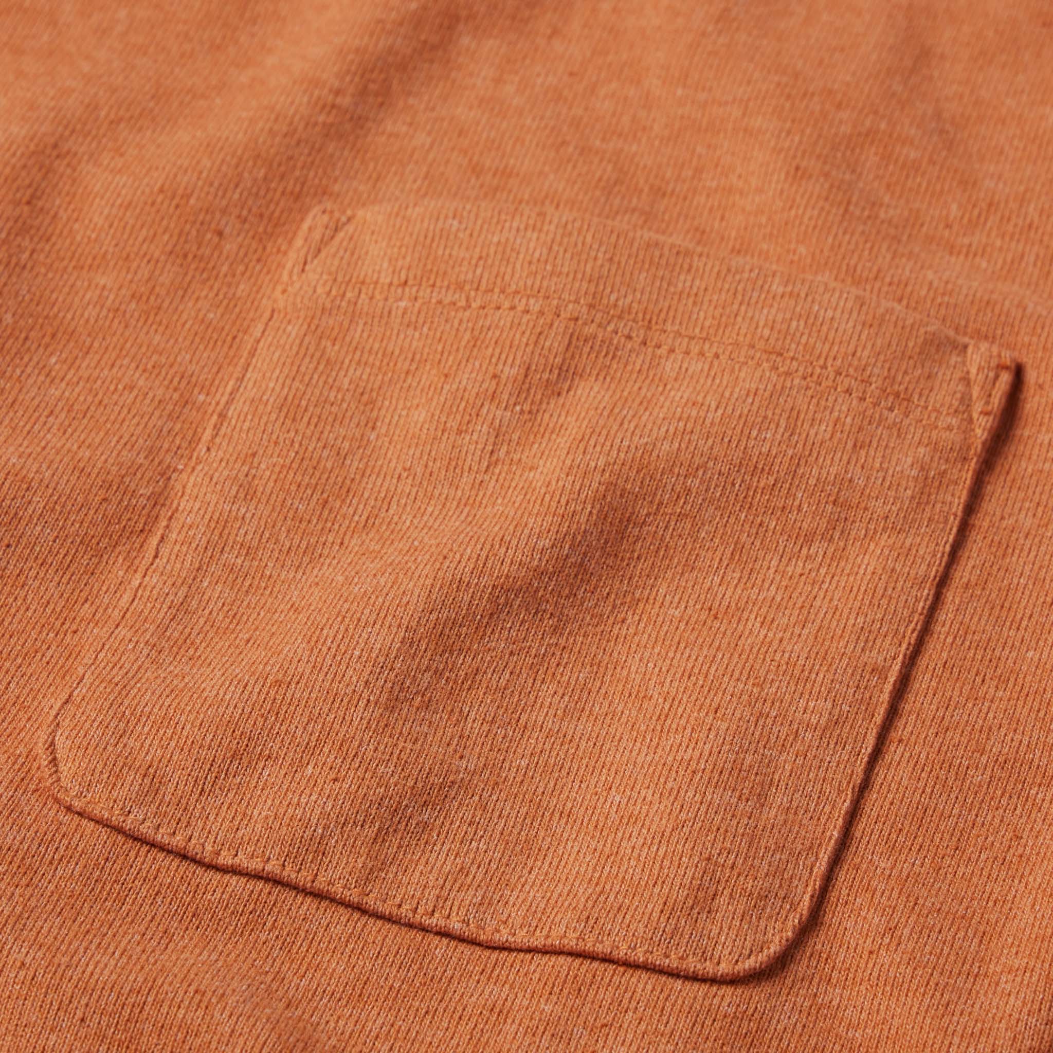 material shot of the chest pocket on The Heavy Bag Tee in Apricot, Knits by Taylor Stitch