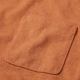 material shot of the chest pocket on The Heavy Bag Tee in Apricot