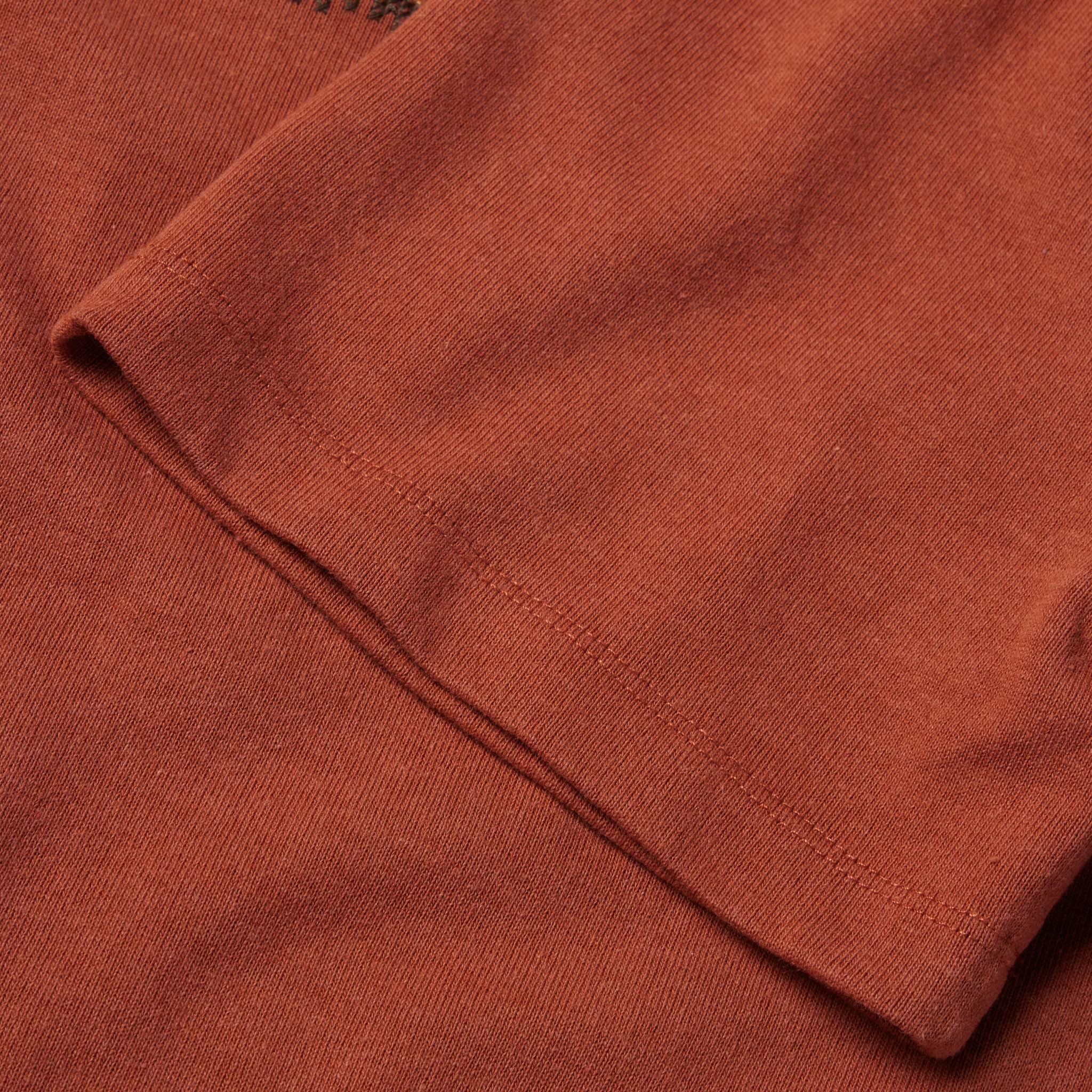 material shot of the sleeves on The Heavy Bag Tee in Dusty Rose Embroidered Stripe, Knits by Taylor Stitch