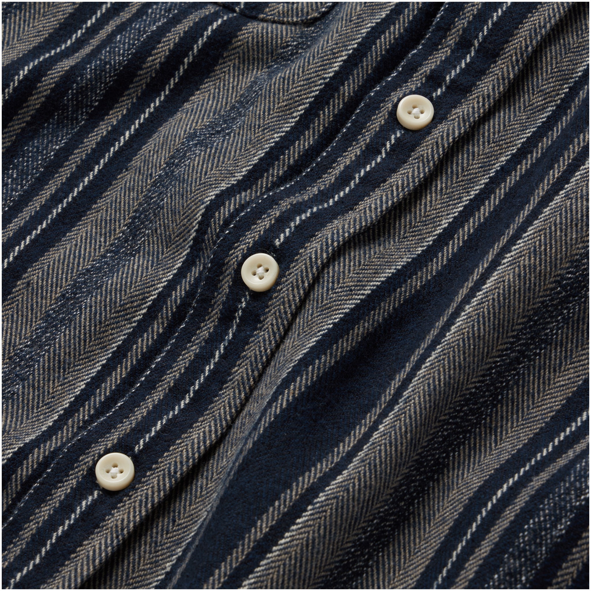material shot of the buttons on The Ledge Shirt in Ocean Stripe, Wovens by Taylor Stitch