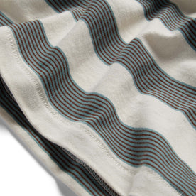 material shot of the hem on The Organic Cotton Tee in Natural and Ocean Stripe