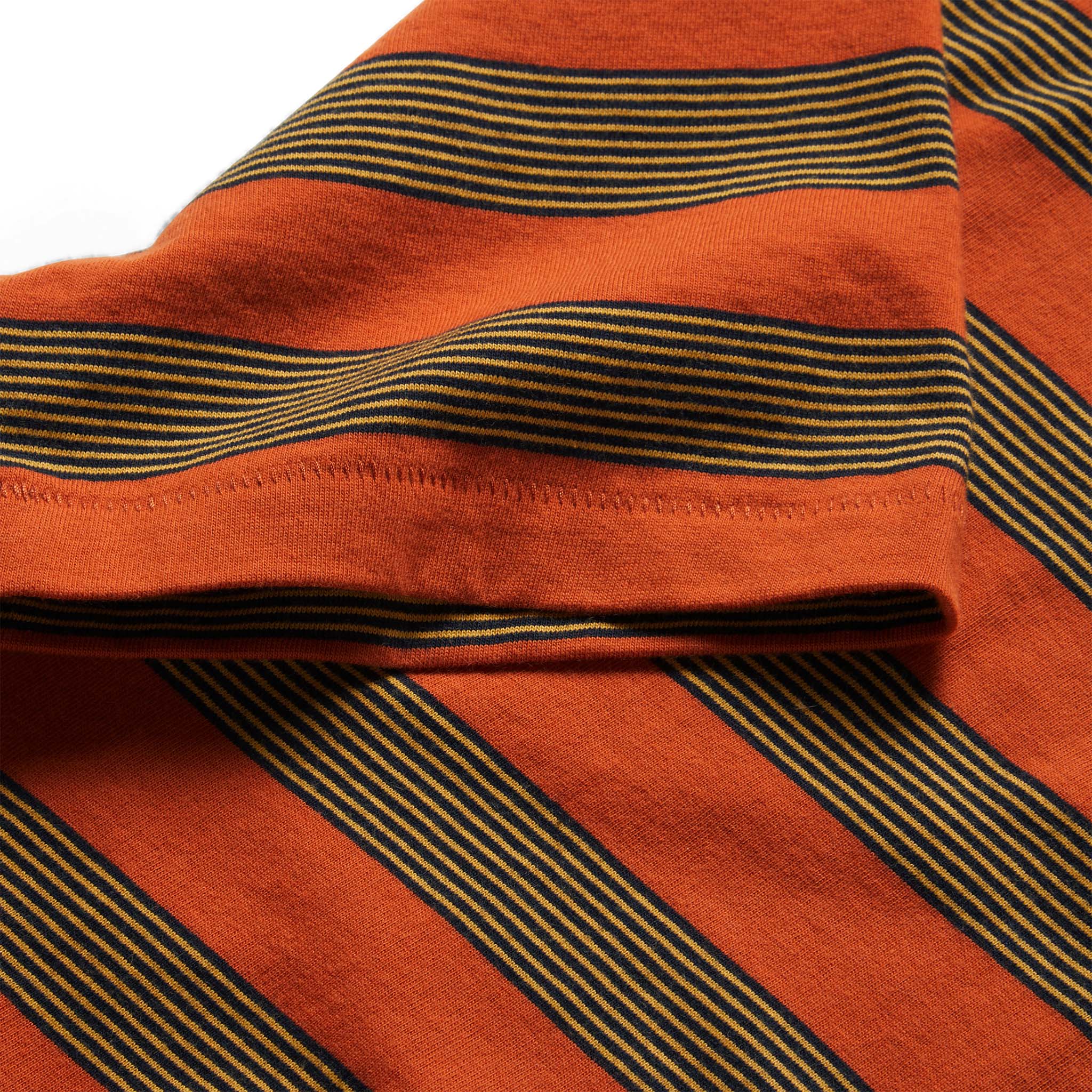 material shot of the sleeves on The Organic Cotton Tee in Rust Stripe, Knits by Taylor Stitch