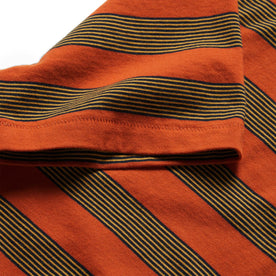 material shot of the sleeves on The Organic Cotton Tee in Rust Stripe