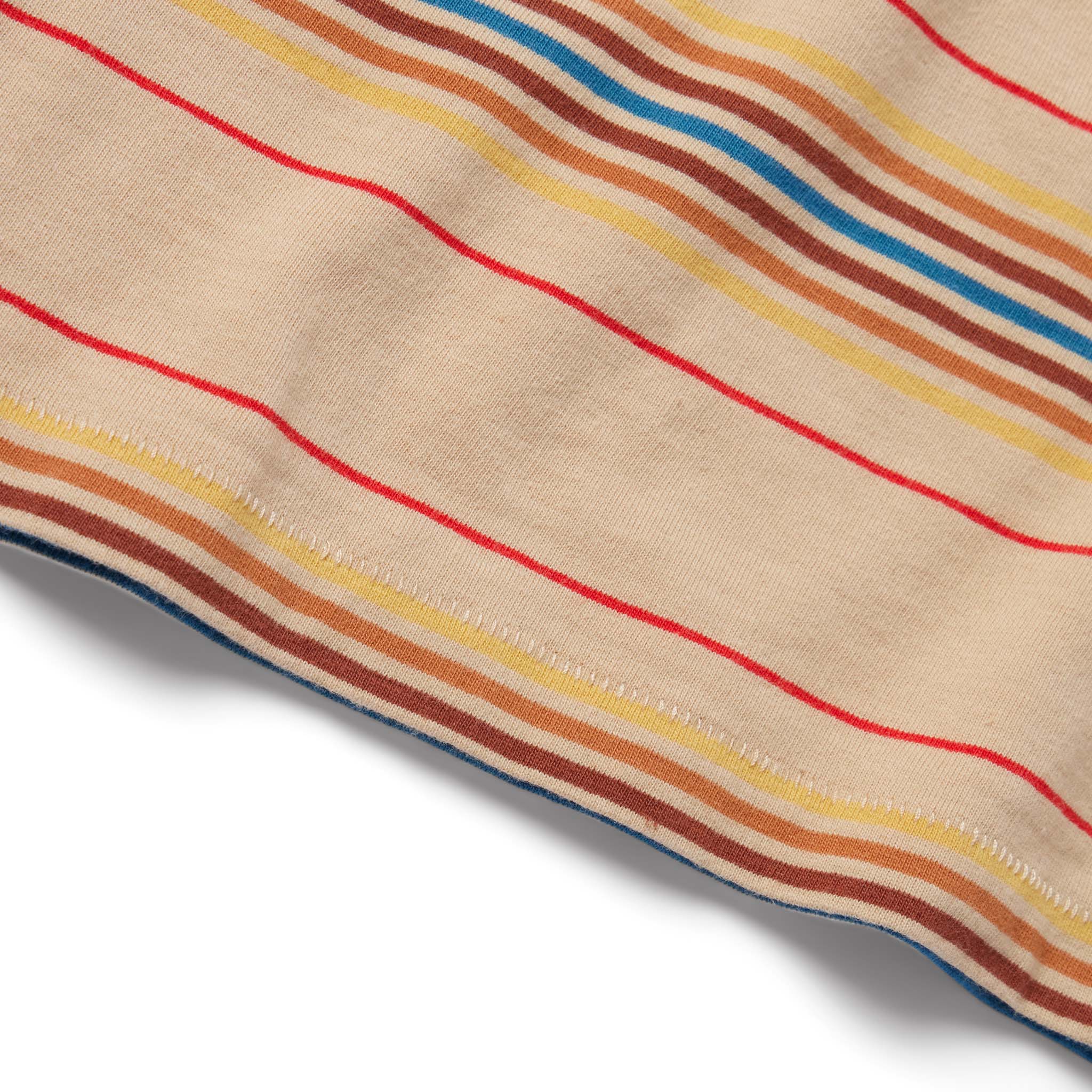 material shot of the hem on The Organic Cotton Tee in Sand Stripe, Knits by Taylor Stitch