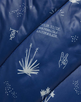 material shot of the pattern on The Original Puffy Blanket in Navy Aloha, Accessories by Taylor Stitch