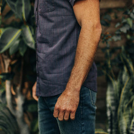 fit model showing the side of The Short Sleeve Jack in Blue Stripe