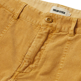 material shot of the button closure on The Trail Short in Gold Micro Cord