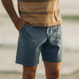 fit model posing with his hand in the pocket of The Trail Short in Ocean Herringbone