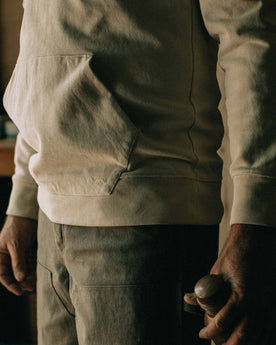 fit mpdel holding a bottle in The Turnover Shirt in Washed Natural, Knits by Taylor Stitch