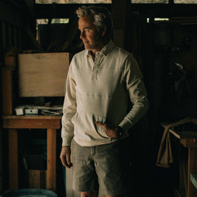 fit model posing with his hand in the kangaroo pocket of The Turnover Shirt in Washed Natural