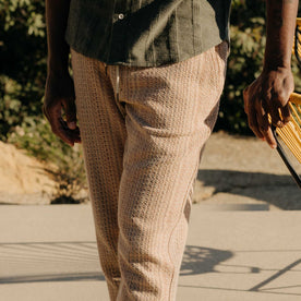 fit model showing the rear pocket on The Apres Pant in Baja Stripe