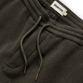 material shot of the drawcord and elasticated waist on The Apres Short in Army Waffle