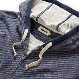 material shot of the drawcords and hood of The Apres Zip Hoodie in Heather Navy Terry
