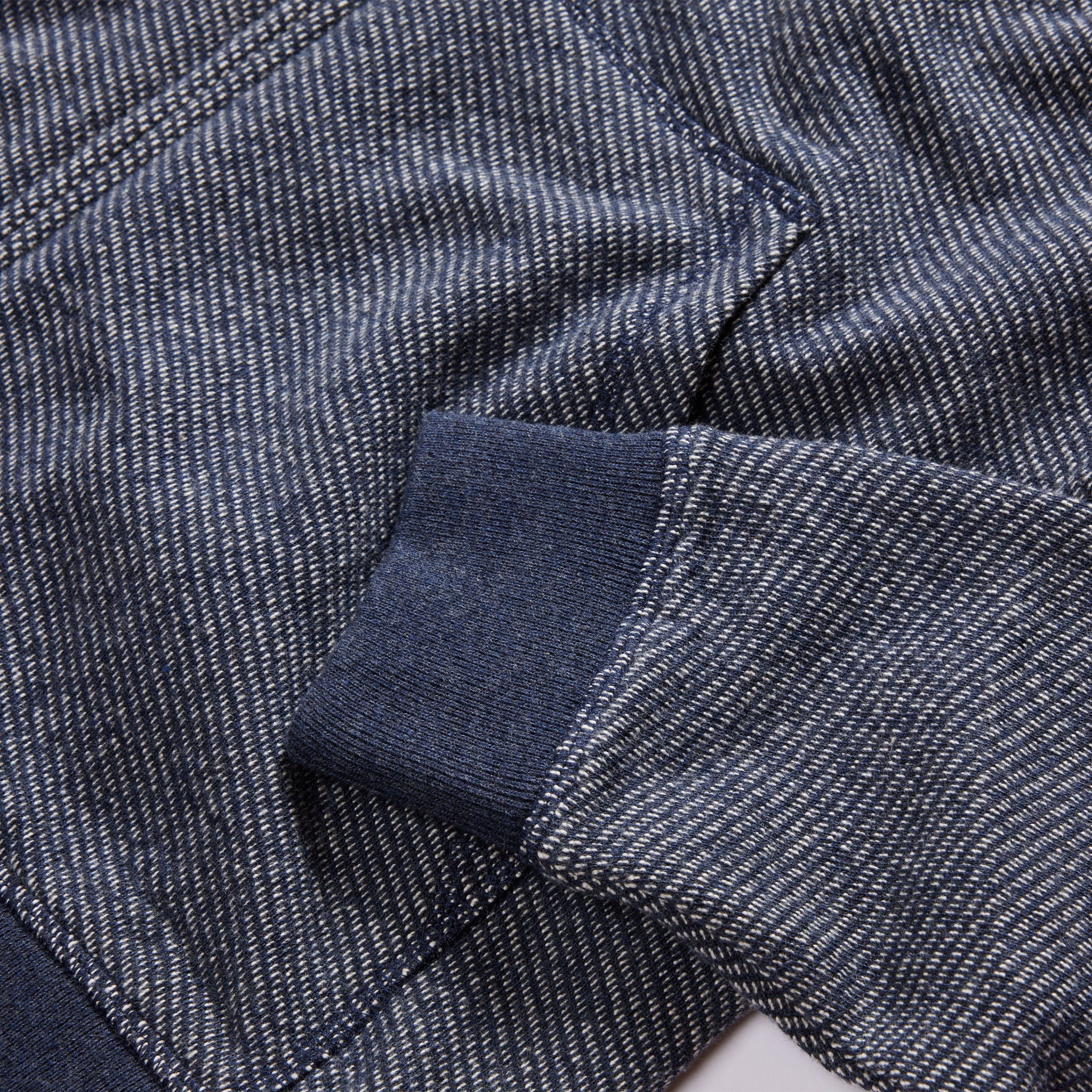 material shot of the ribbed cuffs on The Apres Zip Hoodie in Heather Navy Terry, Knits by Taylor Stitch