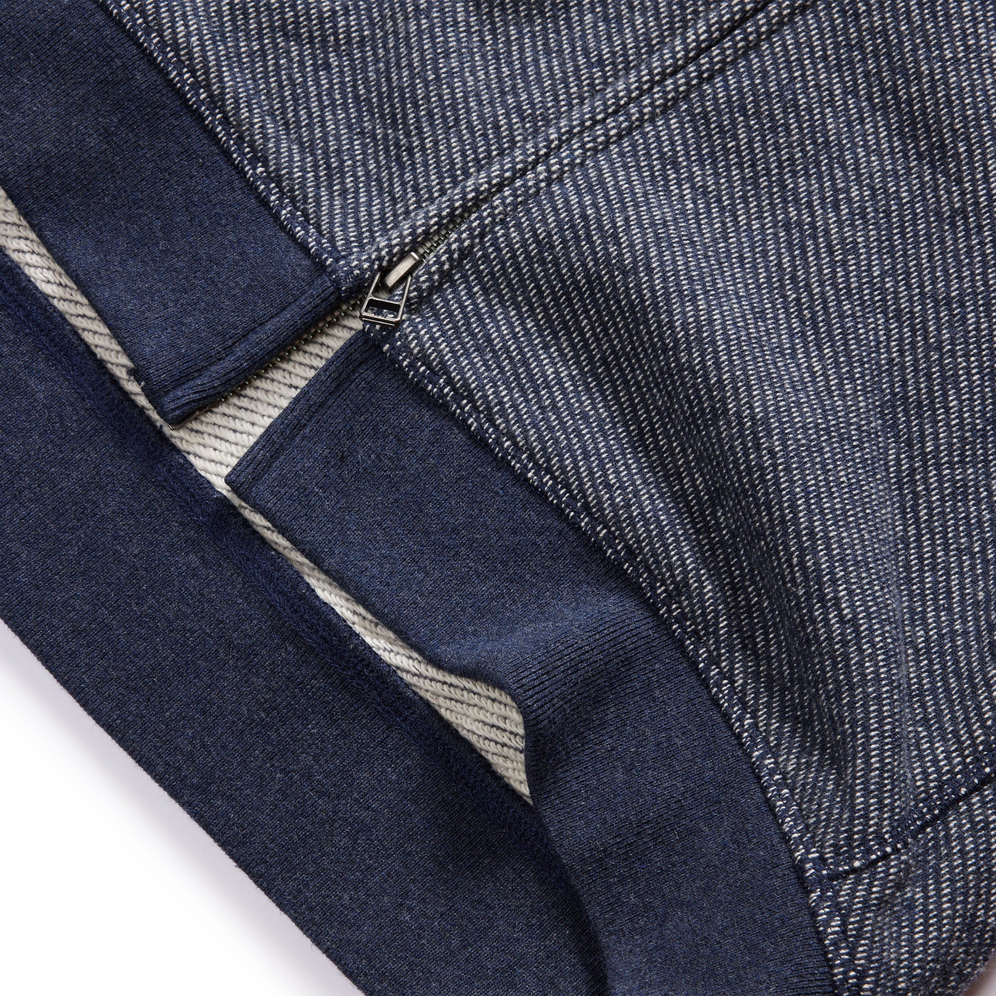 material shot of the ribbed hem on The Apres Zip Hoodie in Heather Navy Terry, Knits by Taylor Stitch