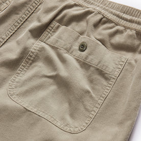 material shot of the rear pocket on The Apres Short in Arid Eucalyptus Micro Cord