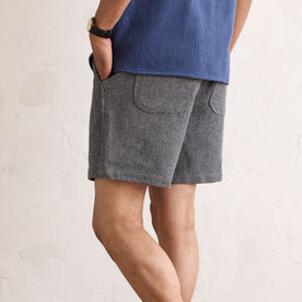 fit model showing the back of The Apres Short in Charcoal Waffle