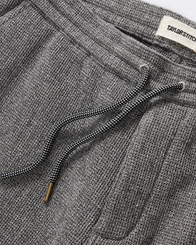 material shot of the drawcords and elasticated waist on The Apres Short in Charcoal Waffle, Bottoms by Taylor Stitch