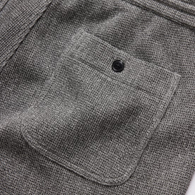 material shot of the rear pocket on The Apres Short in Charcoal Waffle